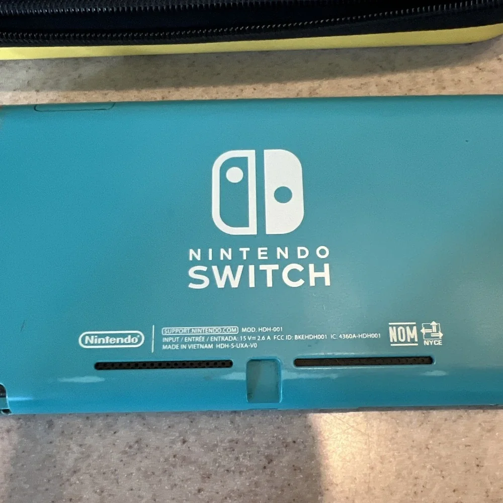 Nintendo Switch Lite Handheld Teal with Pikachu Case One Game And Console Case